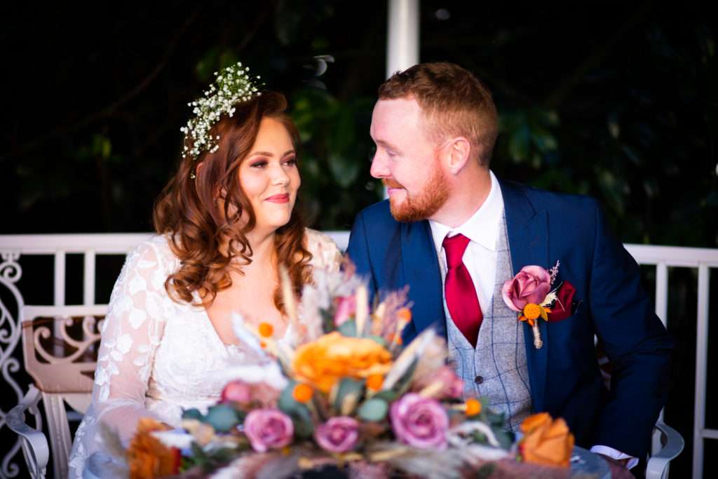 Autumn Wedding Happy Couple with flowers